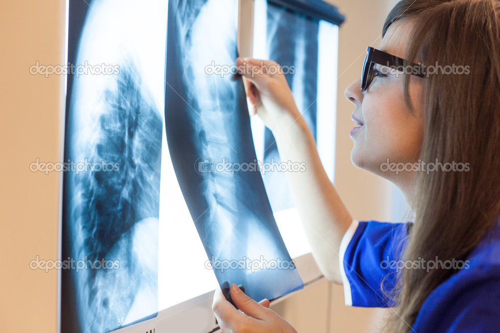 Doctor examining x-ray images