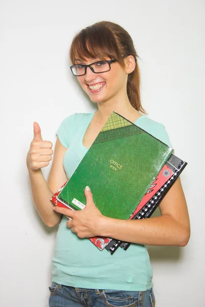 Estudante feminina com blocos de notas — Fotografia de Stock