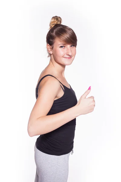 Chica deportiva mostrando el pulgar hacia arriba — Foto de Stock