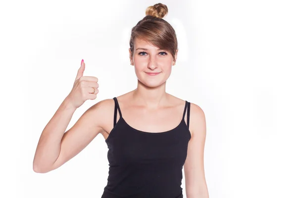 Спортивная девушка показывает большой палец вверх Лицензионные Стоковые Фото