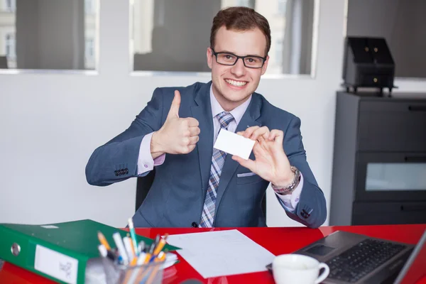 Businessman holding card and showing thumb up — Stock Photo, Image