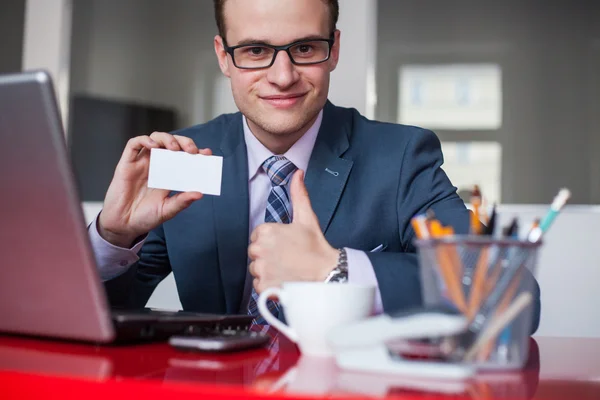 Businessman holding white business card — Stock Photo, Image