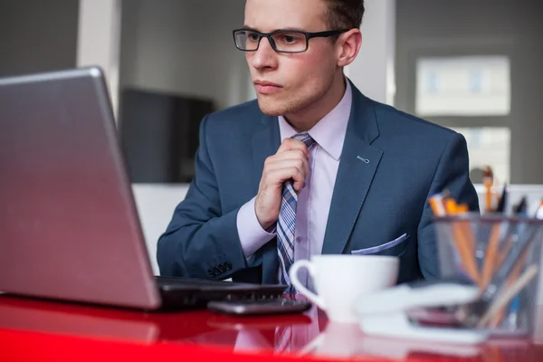 Businessman working in bright office — Stock Photo, Image