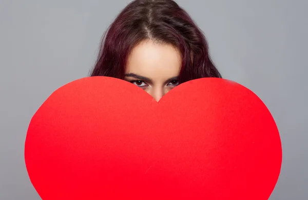 Woman holding paper heart — Stock Photo, Image