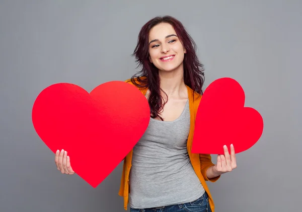 Woman holding paper hearts — Stock Photo, Image