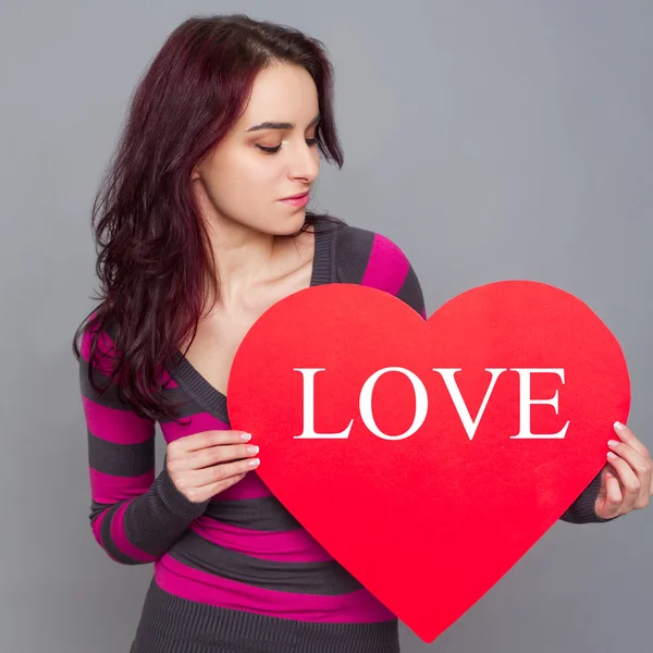 Girl holding paper heart — Stock Photo, Image