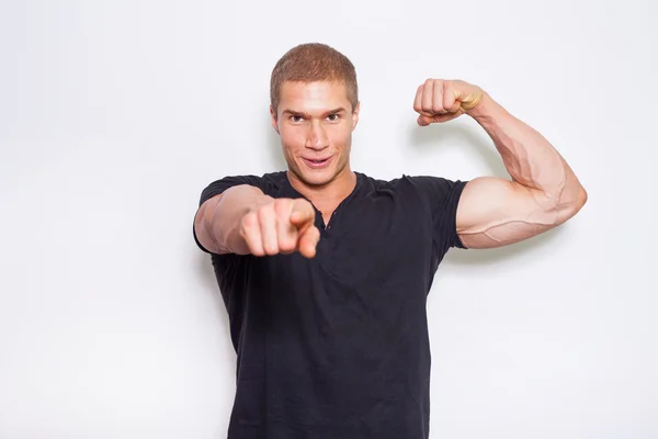 Muscled bodybuilder pointing at camera — Stock Photo, Image