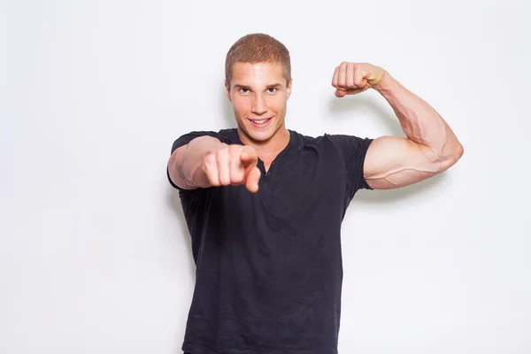 Muscled bodybuilder pointing at camera — Stock Photo, Image