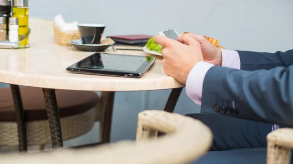 Businessman with tablet and smartphone — Stock Photo, Image