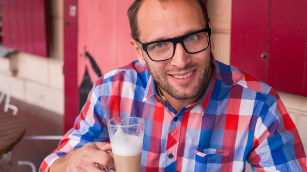 Man with latte — Stock Photo, Image