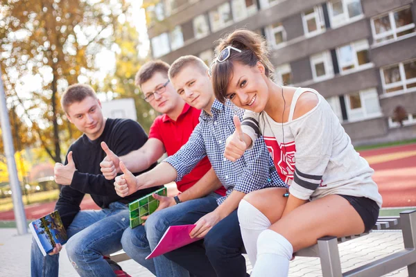 Students showing thumbs up — Stock Photo, Image