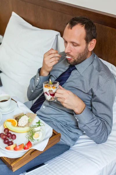 Businessman having breakfast — Stock Photo, Image