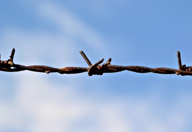 a fence of barbed wire clipart