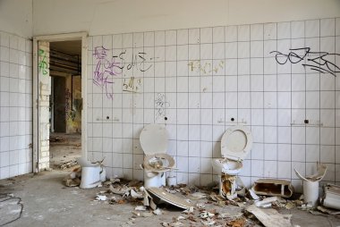 Toilets in a disused factory clipart