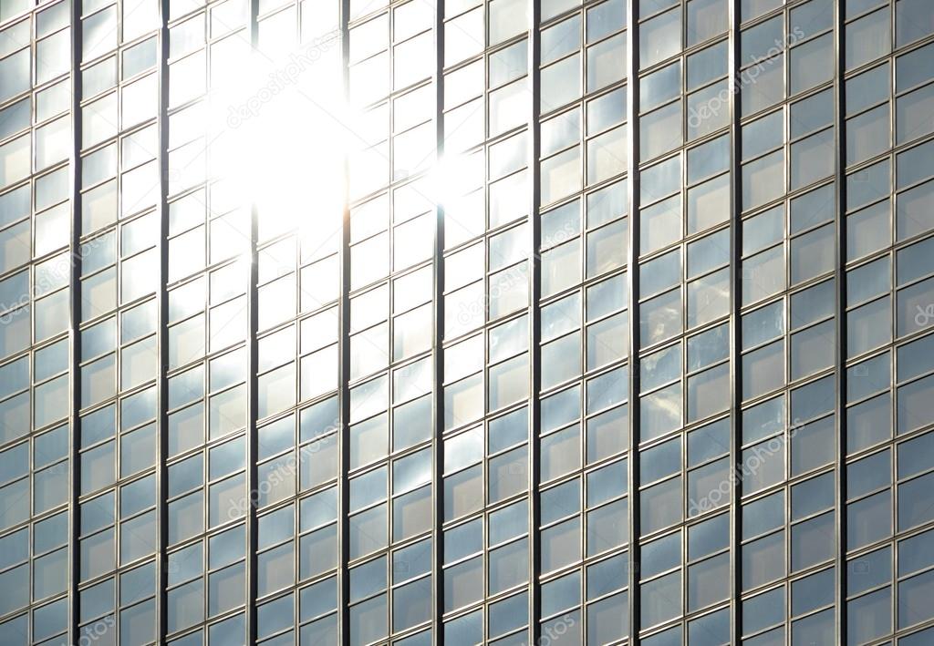 Glass facade with reflection of the sun
