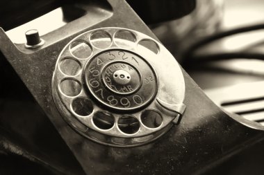 Old telephone on a desk clipart
