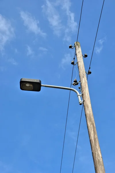 Old street lamp with power cables — Stock Photo, Image