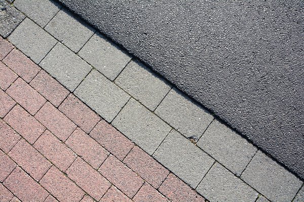 Asphalt and paving stones on a road