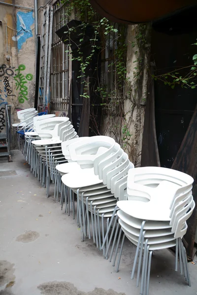 Stacked white chairs — Stock Photo, Image