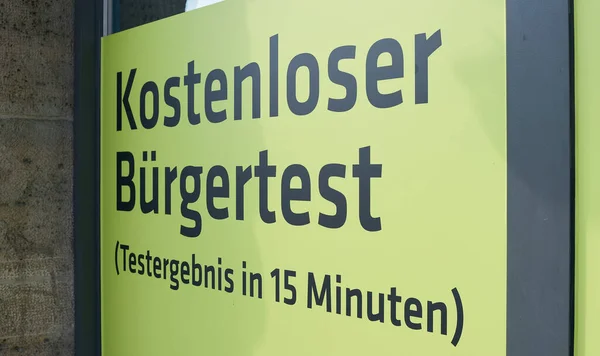 Sign on a window in Berlin with the inscription free corona test for citizens (kostenloser Buergertest)