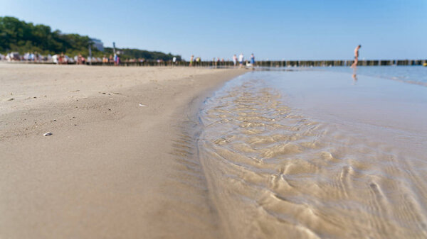   popular beach near Kolobrzeg on the Polish Baltic Sea coast in summer                             