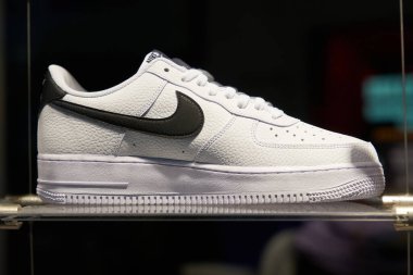  Berlin, Germany  May 26, 2022: Shoe of the American sporting goods manufacturer Nike on a shelf in the illuminated shop window                              