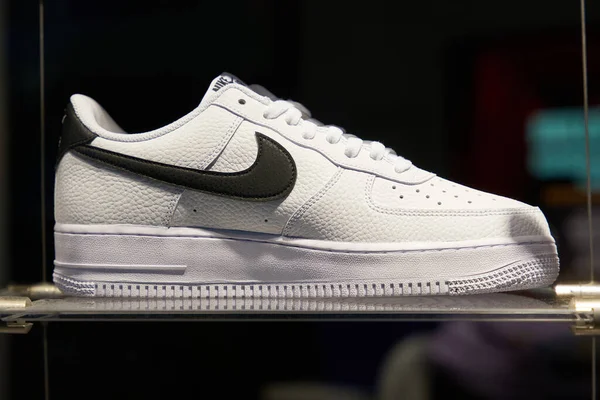  Berlin, Germany  May 26, 2022: Shoe of the American sporting goods manufacturer Nike on a shelf in the illuminated shop window                              