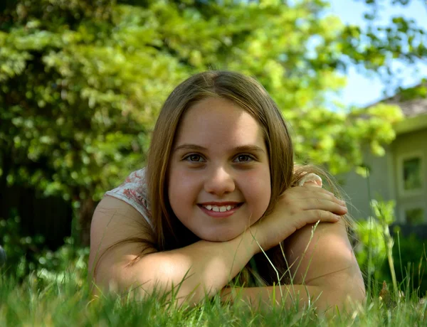 Close up view of a teenage girl sleeping while laying down on long ...