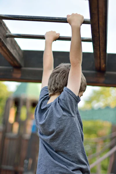 Boy Climbing Monkey Bars — Stock Photo, Image