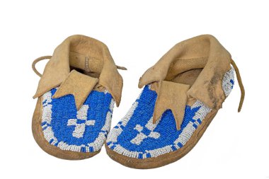 Pearl-embroidered moccasins of the North American Indians isolated on white clipart