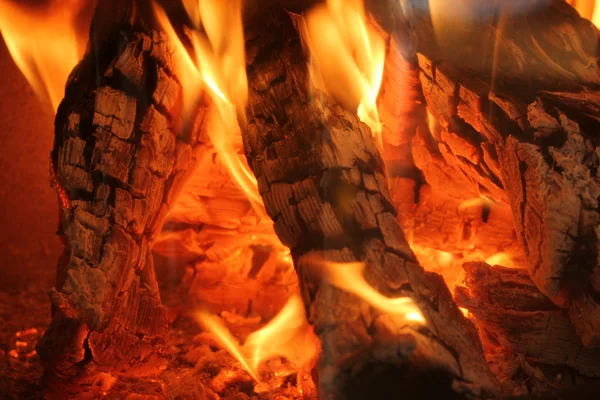 Burning logs in a fireplace — Stock Photo, Image