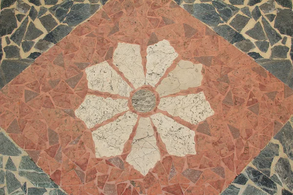 Pavimento de granito con el patrón floral — Stockfoto