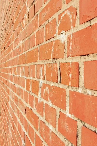 Side view of a red brick wall, architectural background — Stock Photo, Image