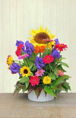 Flower basket with colorful autumnal flowers clipart
