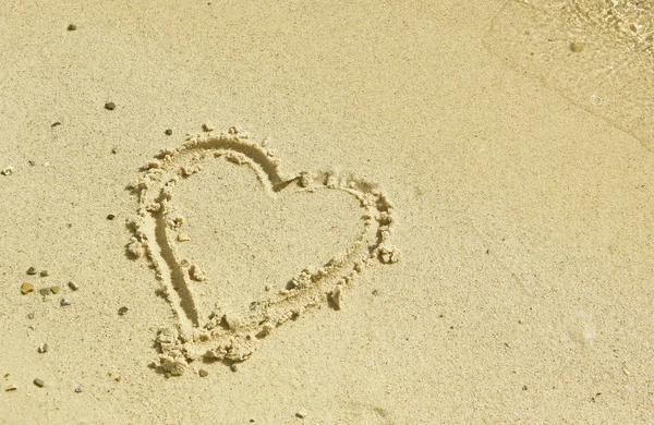 Heart symbol at sandy beach — Stock Photo, Image