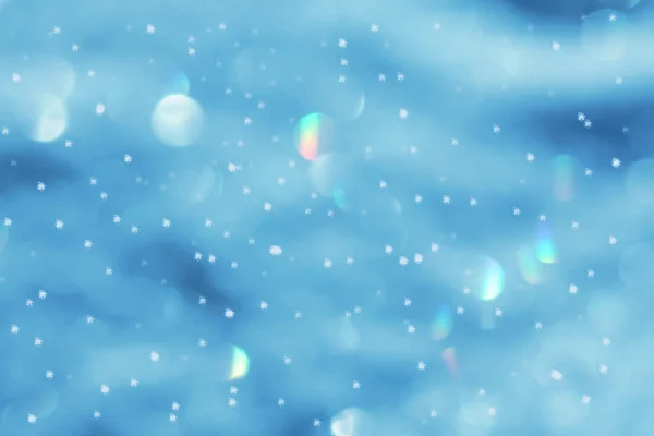 Blurred winter background with snowflakes and flares — Stock Photo, Image