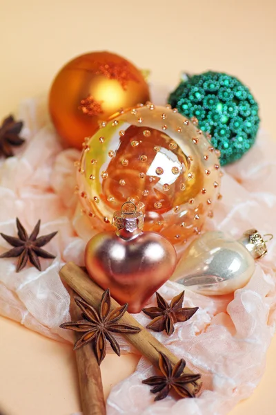Christmas decoration with glossy baubles, star anise and cinnamo — Stock Photo, Image