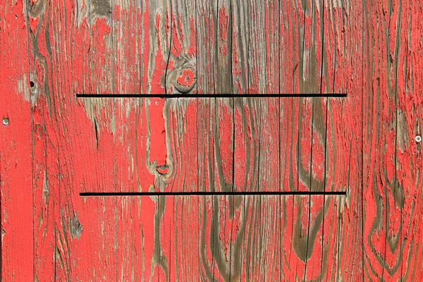 Sfondo in legno verniciato con colore rosso esfoliato — Foto Stock