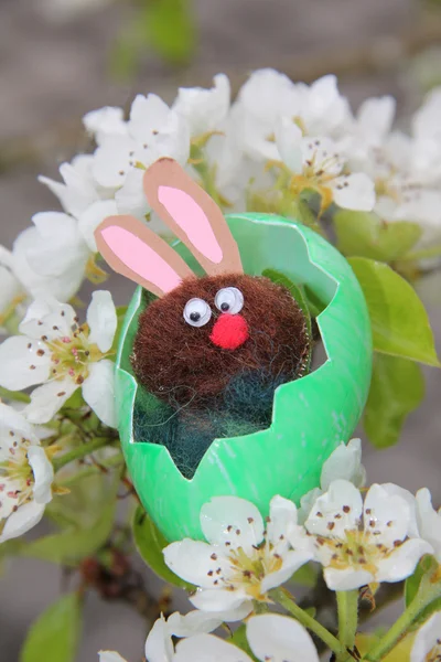 Handcrafted easter bunny in a pear tree — Stock Photo, Image