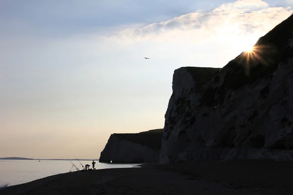 Fiskare i gryningen, jurassic coast, Storbritannien — Stockfoto