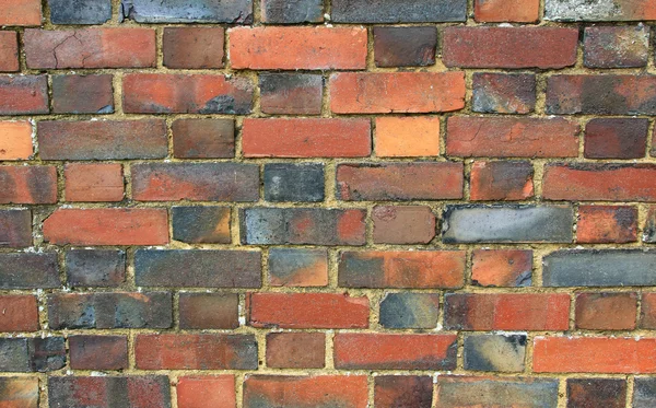 Pared de ladrillo rojo y gris — Foto de Stock