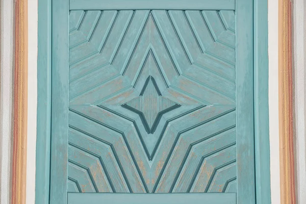 wooden background with star pattern, light dusty blue painted and framed