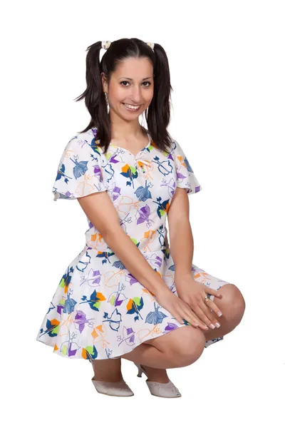 A girl with pigtails in colorful retro dress — Stock Photo, Image