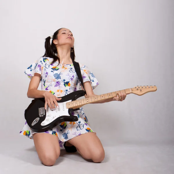 A girl with pigtails in colorful retro dress — Stock Photo, Image