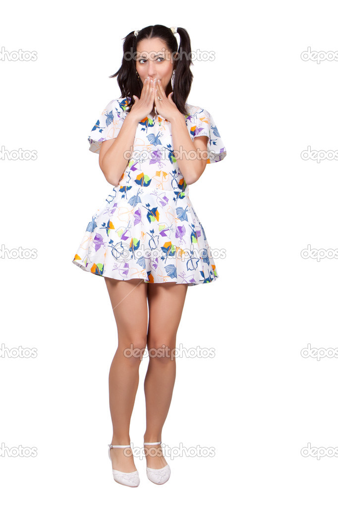 A girl with pigtails in colorful retro dress