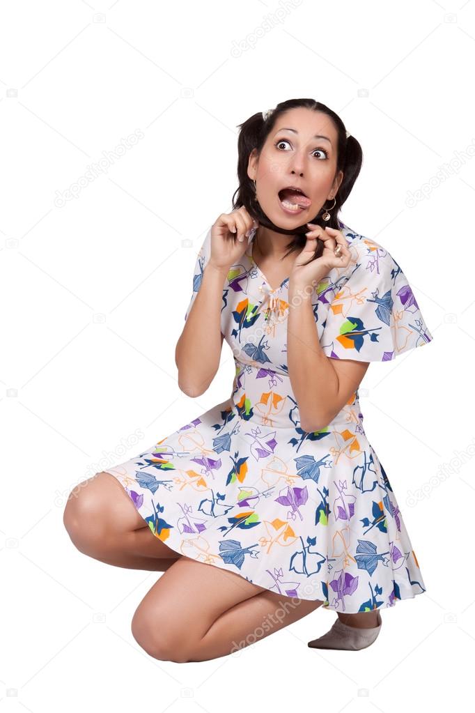 A girl with pigtails in colorful retro dress
