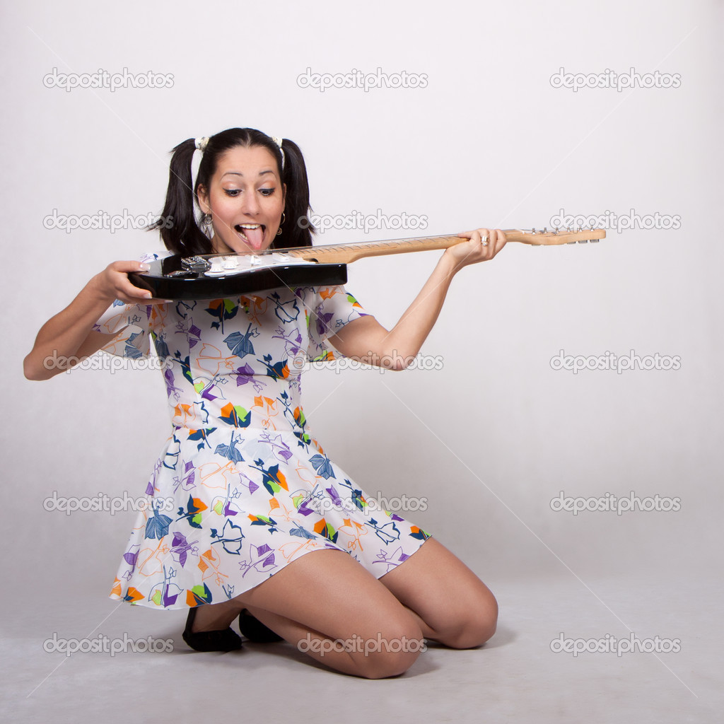 A girl with pigtails in colorful retro dress