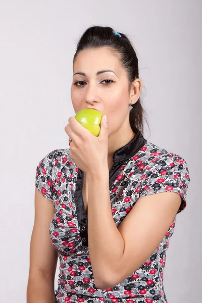 Woman eat green apple Royalty Free Stock Photos