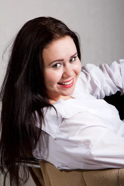 Portrait of long-haired woman in a white men's shirt — Stock Photo, Image