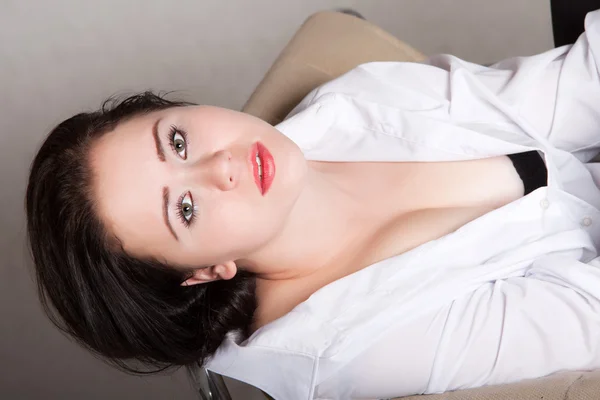 Portrait of long-haired woman in a white men's shirt — Stock Photo, Image